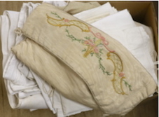 A damask linen table cloth with swan design, various table linens, watered silk embroidered bag, etc
